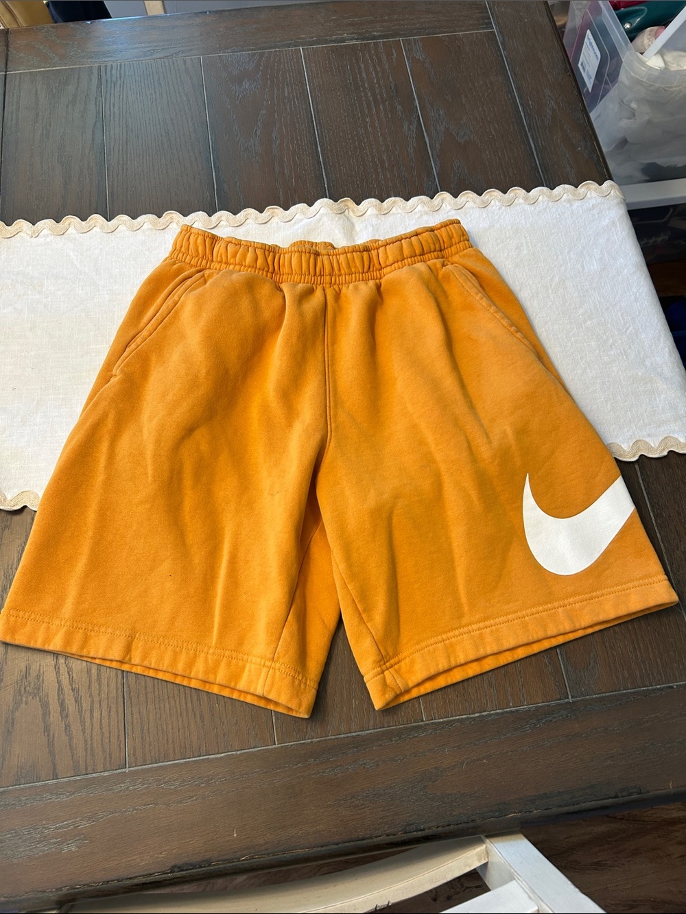 Nike Orange Shorts with White Swoosh Logo